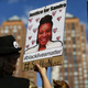 A woman holds a poster bearing the portrait of Sandra Bland during a Michael Brown memorial rally in Union Square in New York City on Aug. 9, 2015.
KENA BETANCUR/AFP/Getty Images